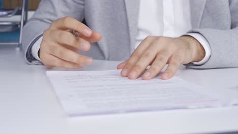 Young-businessman-signing-paperwork-after-checking-information.-Contract,-Agreement.