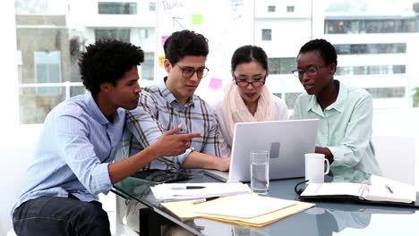 Creative-business-team-having-a-meeting-with-laptop