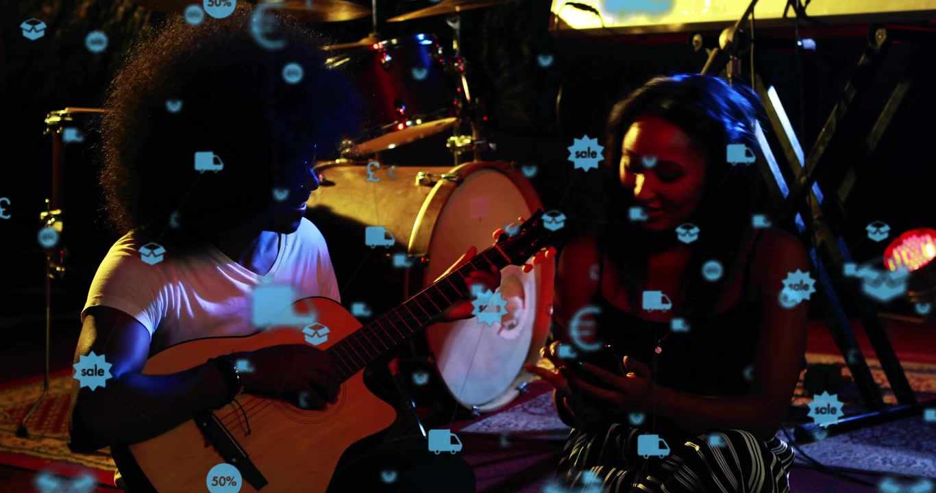 Guitarist strumming, pointing neck, woman leaning, sale $ icons floating over pair promoting music
