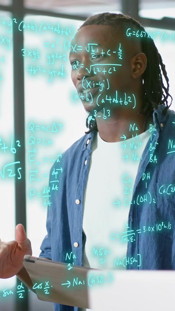 Vertical video: Man speaking with tablet causing teal tech math overlay filling frame teaching