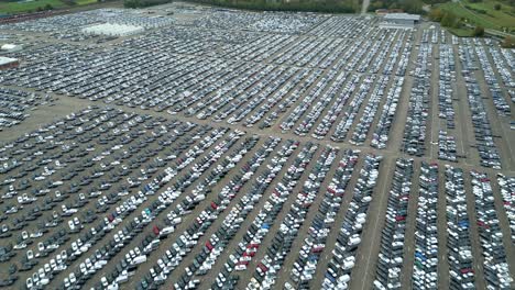 many cars on a parking lot from top, filmed with a drone in 4k