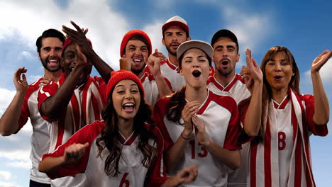 group of fans cheering for their team