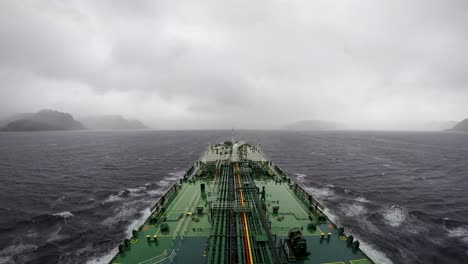 Time-lapse-oil-tanker-transit-Strait-of-Magellan-Punta-arenas-heavy-clouds-rain