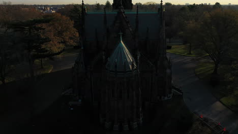 an aerial shot over a cathedral in the shadows which was taken at sunrise