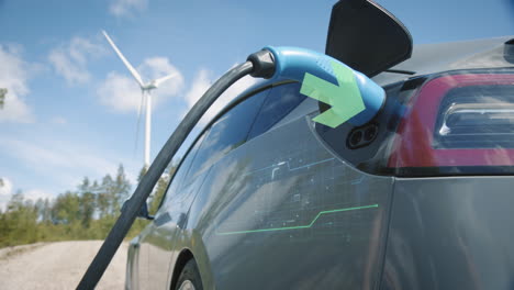 slider, motion graphics show electricity flowing as a generic electric vehicle is plugged in, wind turbine behind