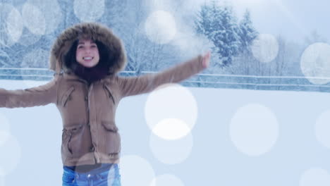 animation of light spots over caucasian woman jumping with arms outstretched