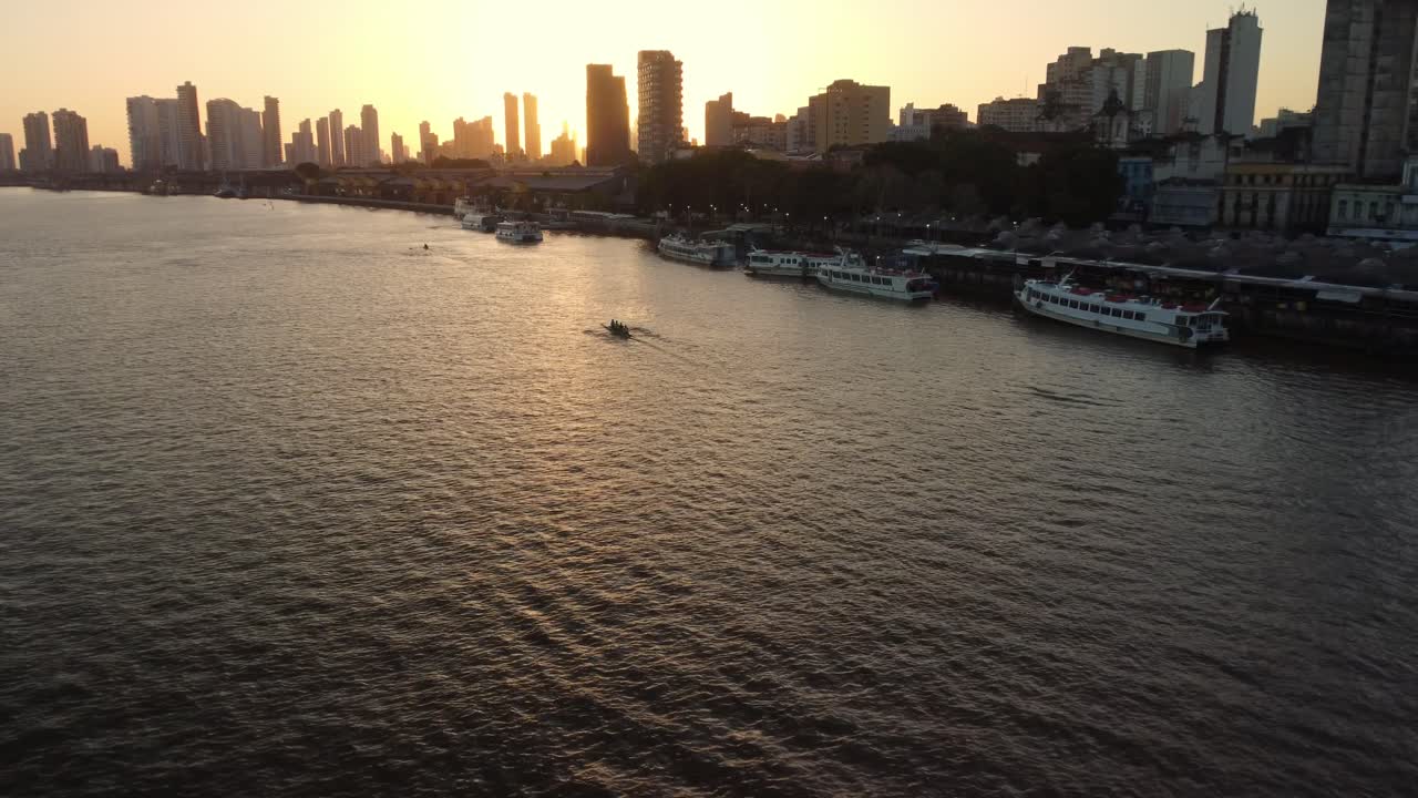 Golden sun setting over Amazon waterfront skyline in Belem, Brazil