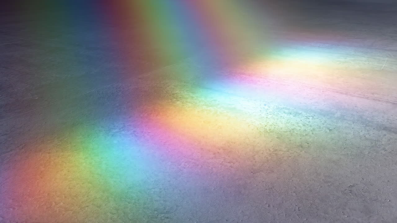 Rainbow Light Spectrum on a Grey Concrete Floor