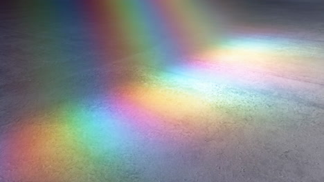 rainbow light spectrum on a grey concrete floor