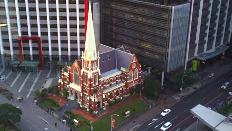 Static-shot-capturing-the-architectural-details-of-iconic-landmark-Albert-street-uniting-church-from-above-with-traffics-on-Ann-street,-downtown-Brisbane-city