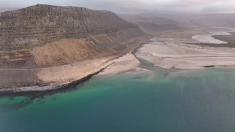 tranquil beach in westfjords region of iceland - aerial shot