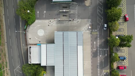 Birds-eye-flyover-of-a-supermarket-petrol-station-and-car-wash