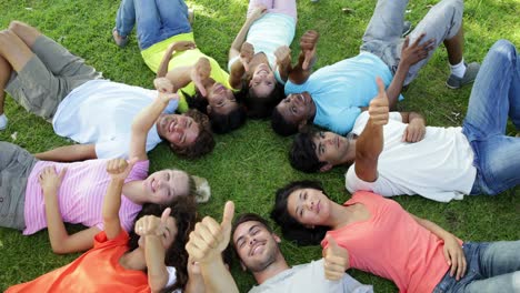 Group-of-casual-young-friends-lying-in-a-circle