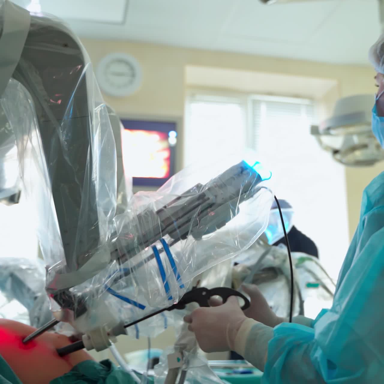 Futuristic robotic surgery in operating room. Doctor performs a minimally invasive operation with modern medical equipment. Robotic arms during microsurgery