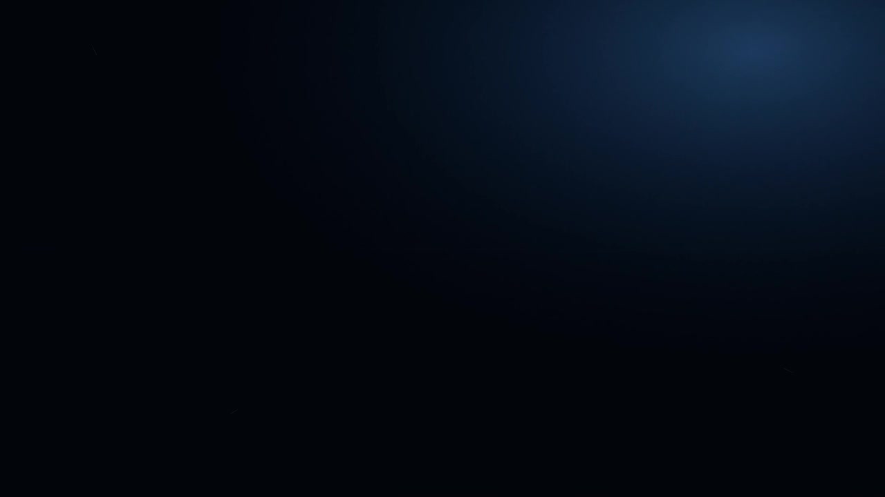 Abstract Dark Background with Subtle Blue Light Flare
