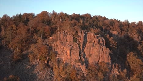 rotating pan from of the rock formation battert above the spa town of baden-baden revealing the valley in autum at golden hour
