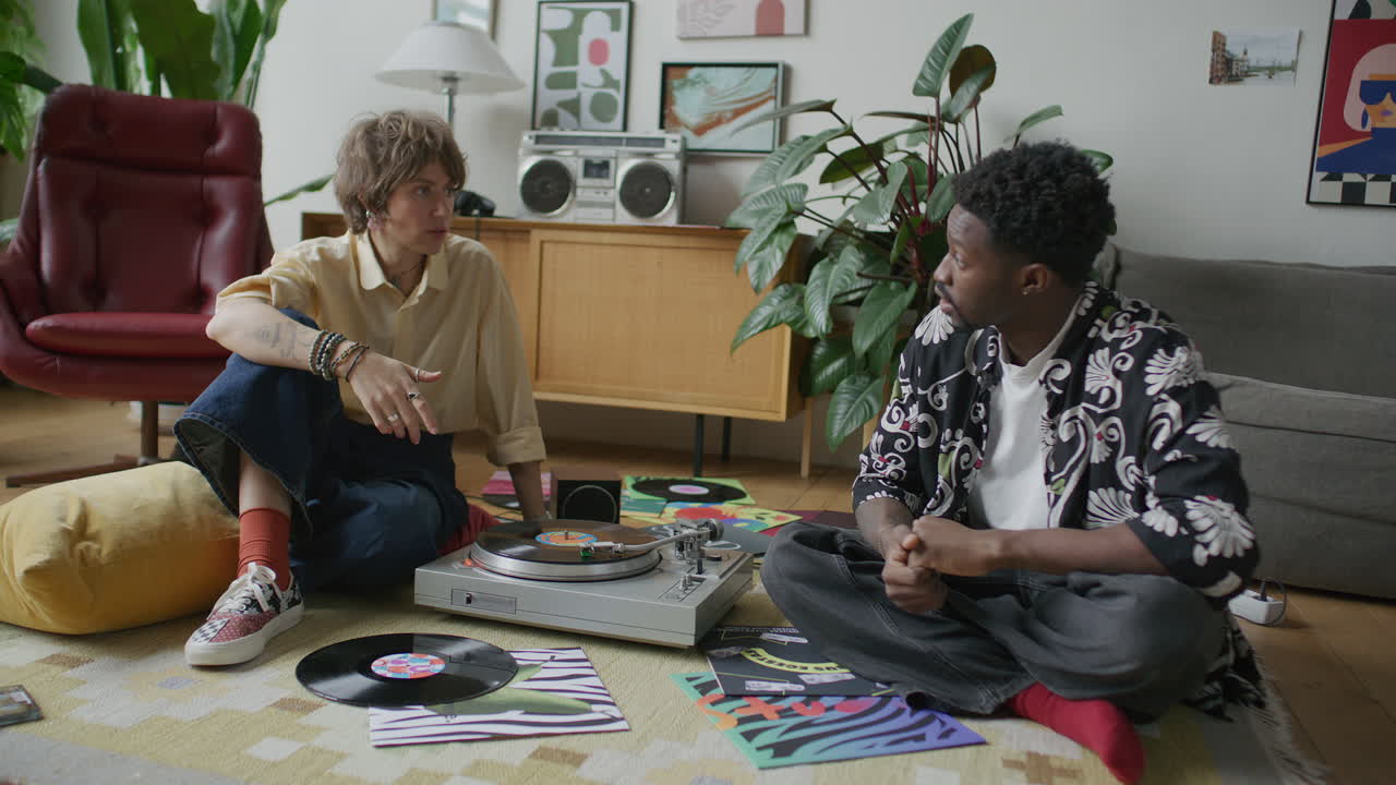 Couple Enjoying Music Played on Vinyl Turntable, Dancing and Talking at Home