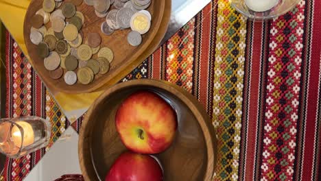 coin and candle with samanu full of nuts pistachios russian olive on table colorful nowruz haftsin decoration apple lantern traditional tehran interior scenic nature morning architecture travel view