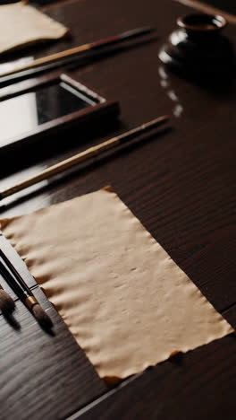calligraphy set on wooden table