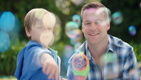 father-and-son-blowing-soap-bubbles-together-in-sunny-park-happy-little-boy-having-fun-dad-playing-with-child-playfully-enjoying-summer-4k