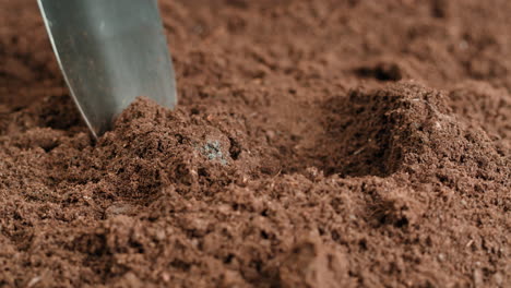 preparing soil with shovel