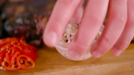 Man-placing-yogurt-with-chopped-onions-on-the-flank