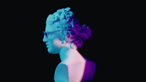 neon illuminated classical bust with glasses