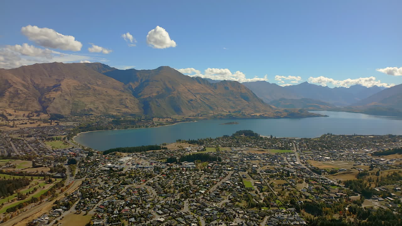 Wanaka resort town and Lake Wānaka basin South Island, New Zealand - aerial panoramic parallax