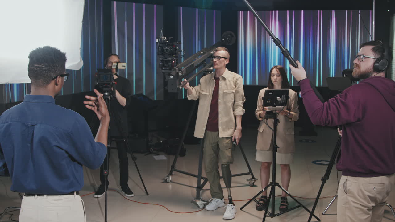 Filmmaking Crew Shooting Video With Camera Crane