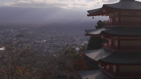 slow close up tilt over chureito pagoda and mount fuji at dusk