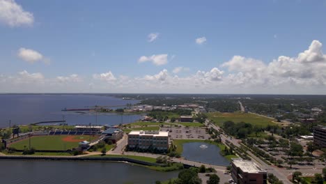 drone shot over historic downtown pensacola in florida on a very cloudy and sunny day