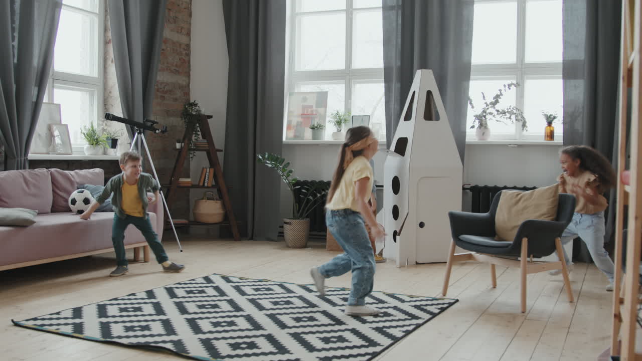 Happy Little Girls Playing Tag at Home