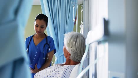 Senior-patient-being-checked-by-female-doctor-in-the-ward