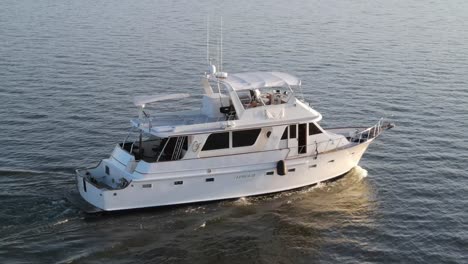 White-Yacht-Travelling-In-The-Sea-On-A-Sunny-Day