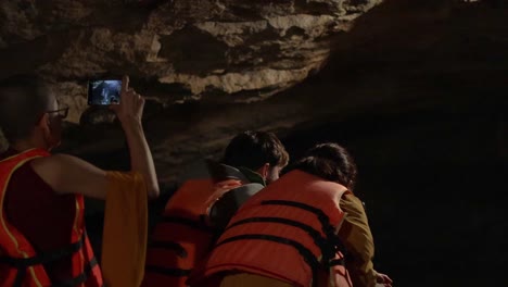 group in life jackets inside cave