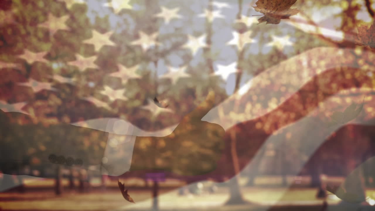 미국  ⁇ 발이 흔들리고 손이 엄지손가락을 들고 가을 잎이 공원에 떨어지고 있습니다.