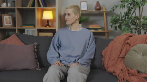 woman sitting on a sofa in a living room