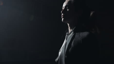 dramatic portrait of a woman in low-key lighting