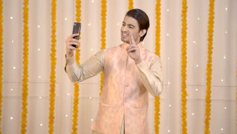 Indian-man-taking-selfies-on-festival