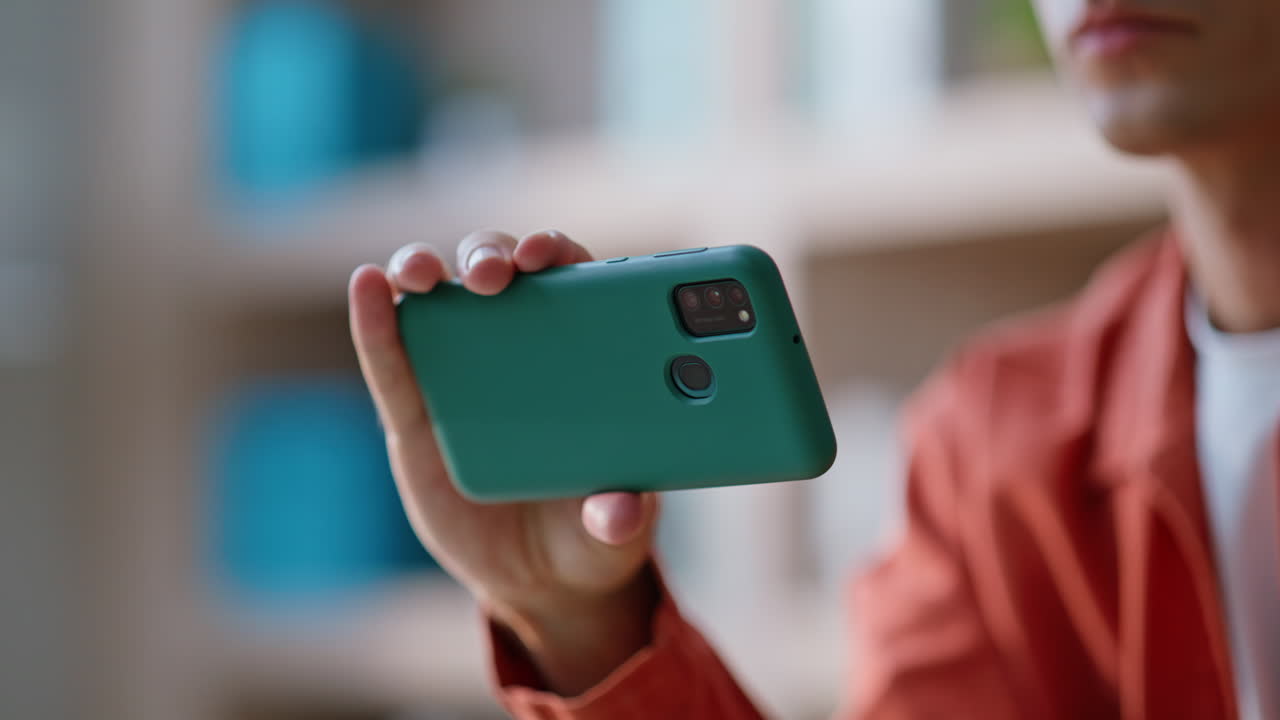 Man browsing horizontal smartphone content sitting workplace closeup crop shot