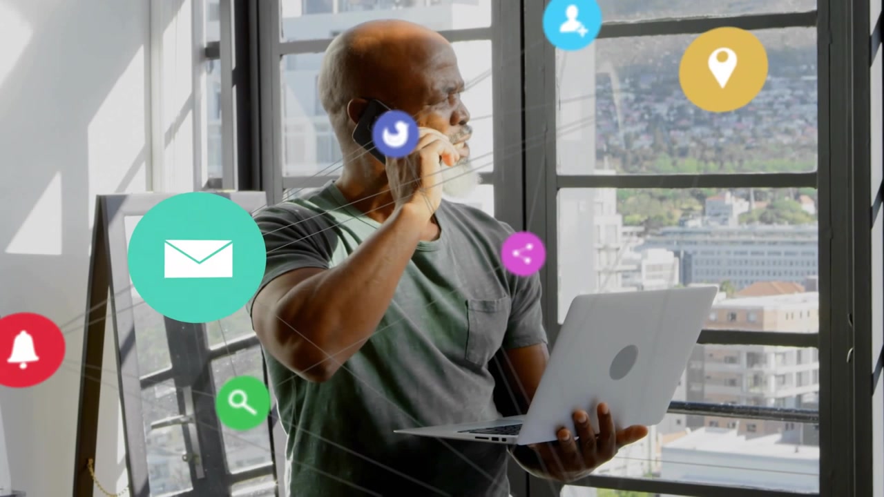 Man checking laptop while on business call, causing app icons orbiting torso, then thinning outward