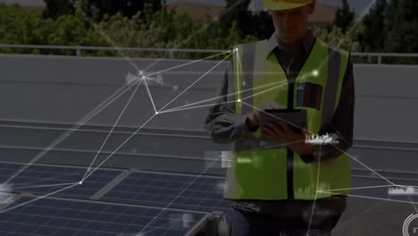 animation of network of connections over solar panels and male engineer using tablet in background
