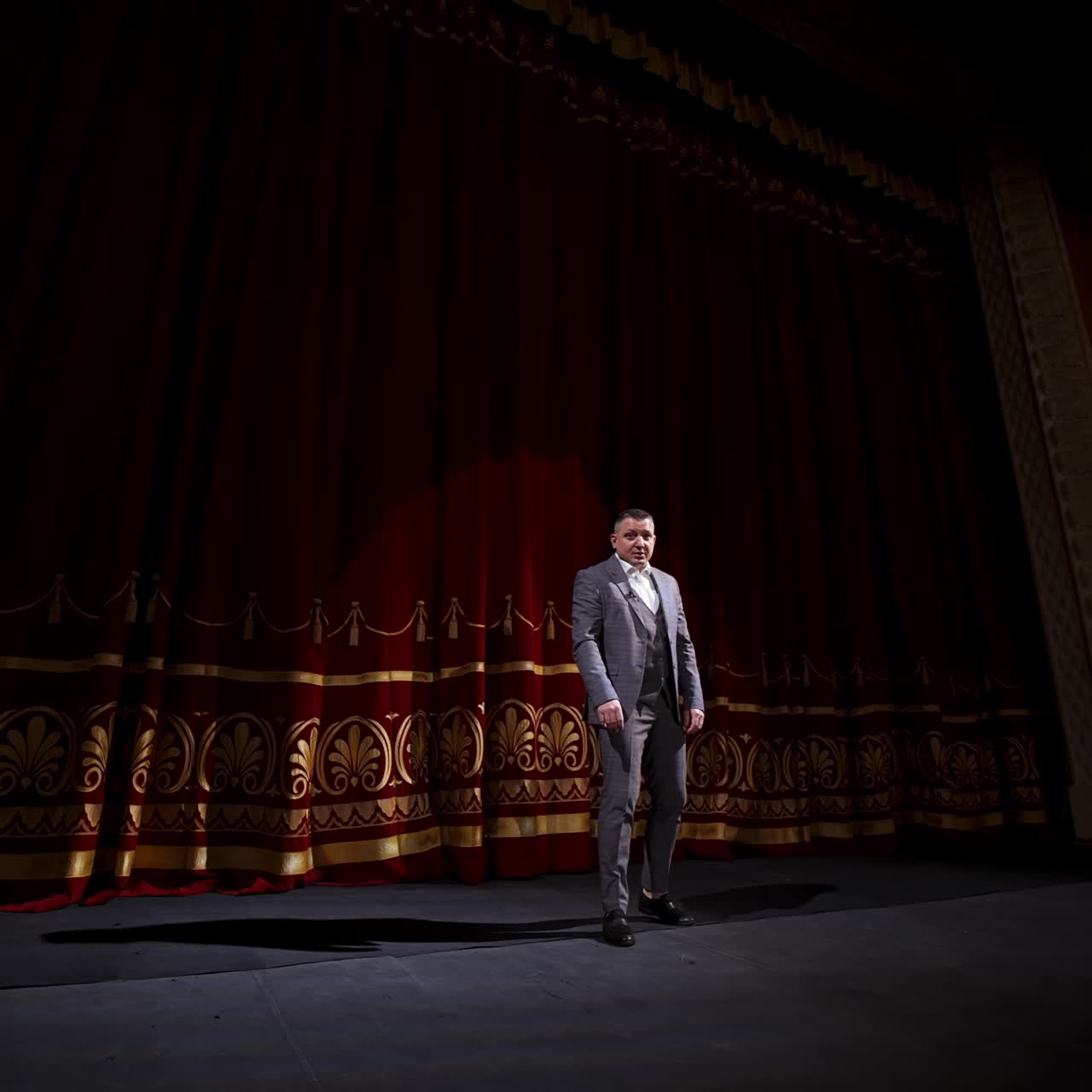 Motivational Speaker. Male actor on classic theatre stage