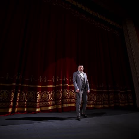 motivational speaker. male actor on classic theatre stage