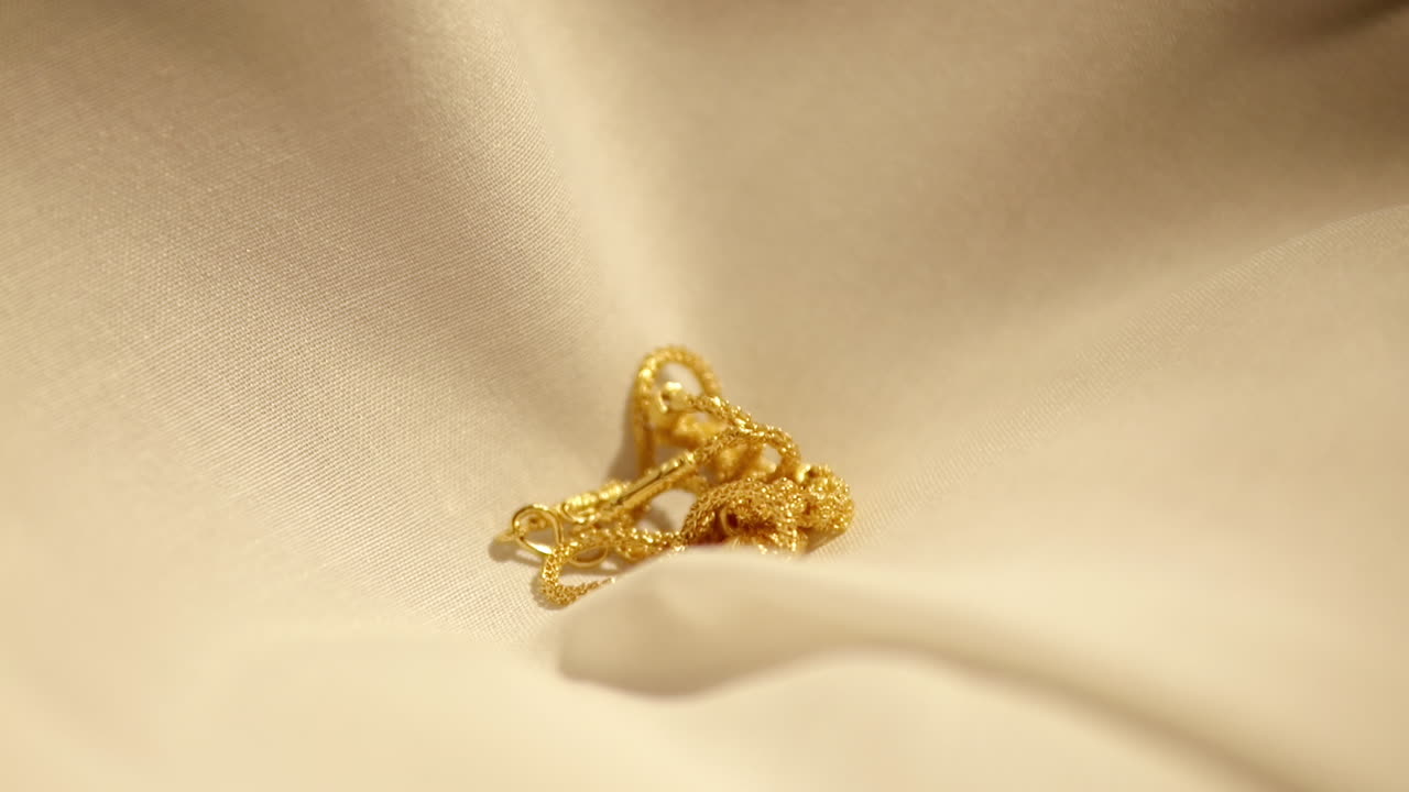 Gold Wedding Necklace dropped on velvet cloth