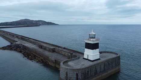 holyhead breakwater lighthouse longest concrete coastal sea protection landmark aerial view wide right orbit reveal