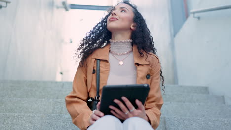 Smile,-stairs-and-woman-typing-on-tablet-in-city