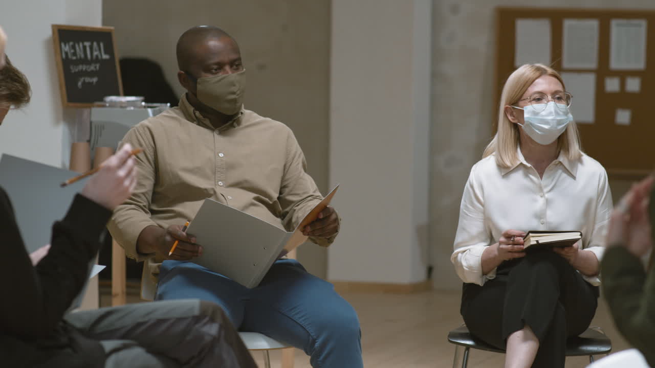 Group of People Sitting in Circle at Therapy Session