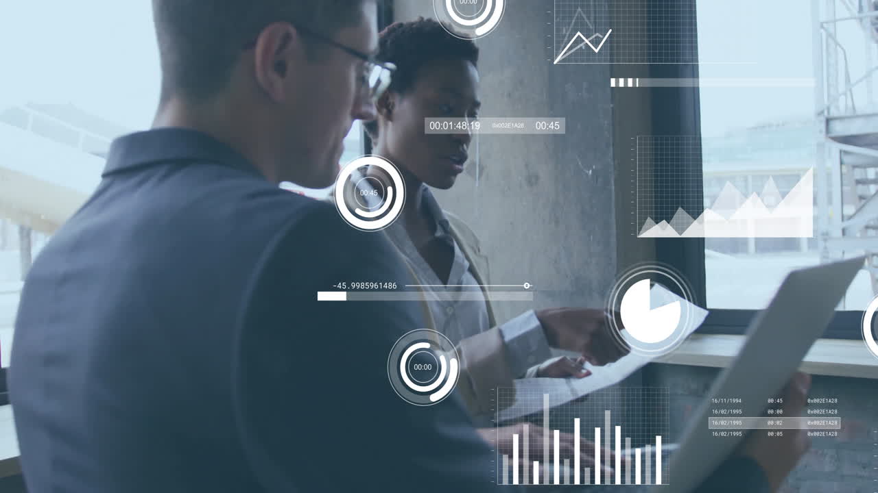 Analyzing data, business professionals using digital graphs and charts in office