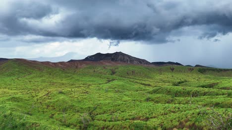 dramatic volcanic landscape under a stormy sky